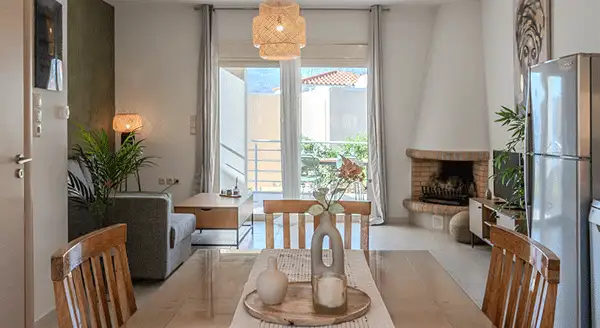 A family gathered around a festive dinner table, holding sparklers and smiling