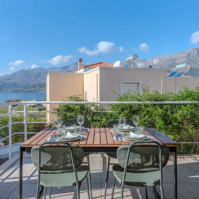  A table set with various plates of food and drinks, showcasing a colorful and inviting meal arrangement.